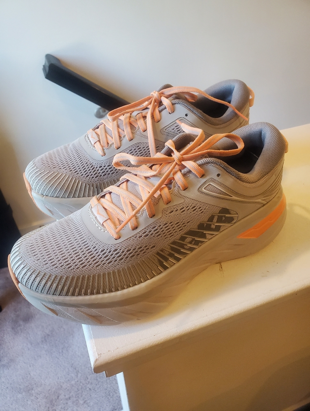 HOKA Bondi 7 running shoes in a clean gray & peach colorway - Picture 2 of 7